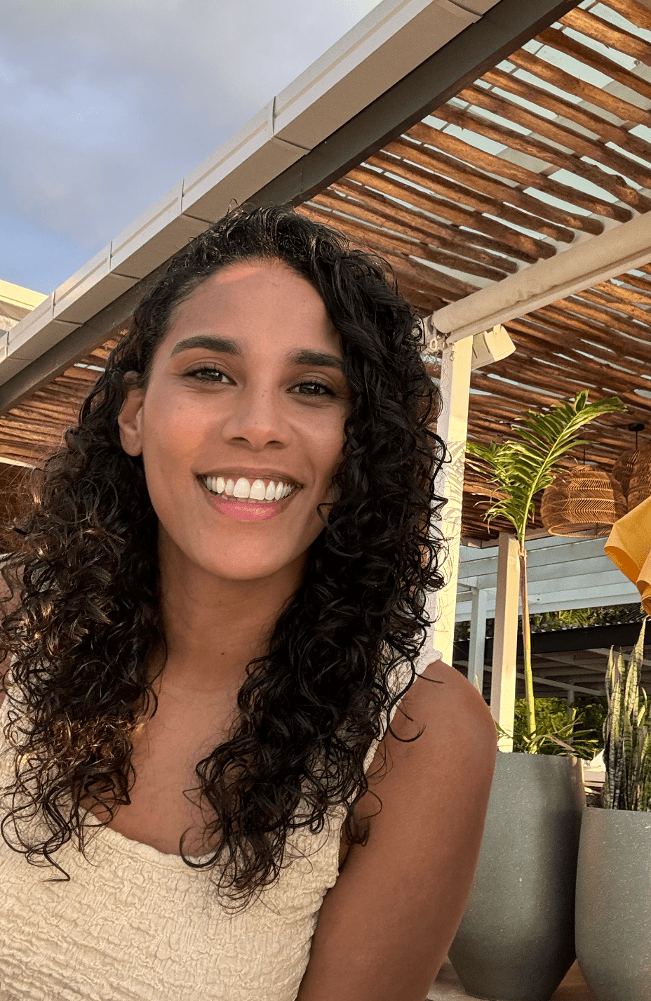 Rachael, founder of Kova Silk, showcasing her natural curls
